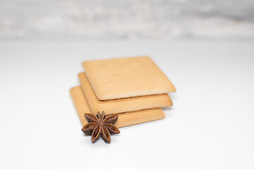 cookies and star anise on a white background. aromatic spices for baking cookies for Christmas