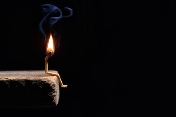 Conceptual burned out wooden matches on black background