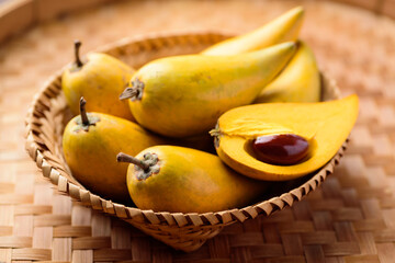 Eggfruit or canistel in a basket, Thai fruit, In Thai names such as Xiantao, Lamut Khamen or Mon khai
