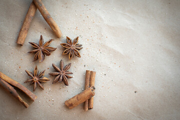 aromatic spice star anise and cinnamon on a gray background. it is used for making mulled wine.