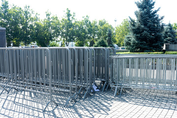 A portable metal event fence stocked in one place.
