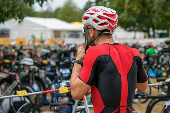 Triathlete Puts His Helmet On His Head Before Starting Cycling