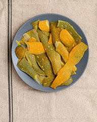 background of peeled zucchini or pumpkin in plate on table