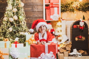 Obraz na płótnie Canvas Happy kid having fun with gift. New year concept. Winter kid. Christmas children. Child with gift. Winter Christmas emotion.