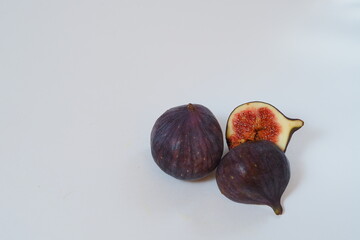 Food. Exotic fruit. Purple figs close up on a white