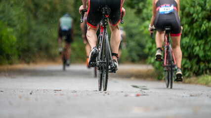 Fototapeta na wymiar Triathletes cycling at a triathlon competition