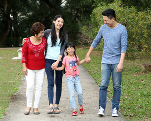 Southeast Asian multigeneration family parents daughter grandmother father mother child walk talk fun play outdoor park