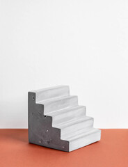 concrete podium on earthy tone background. Pedestal, place for product