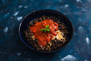 plant-based food, spaghetti with tomato sauce and black beans