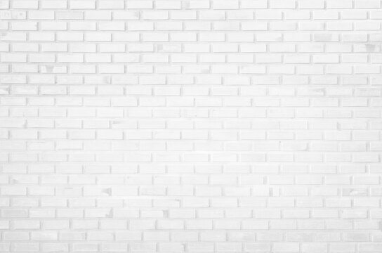 White brick wall texture background in room at subway. Brickwork stonework interior, rock old concrete grid uneven abstract weathered grey clean tile design, horizontal architecture wallpaper.