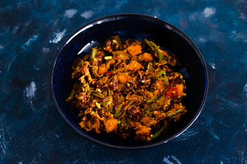 plant-based food, mixed vegetables and red kidney beans with spicy sauce