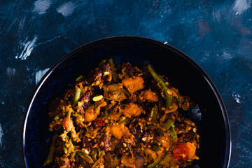 plant-based food, mixed vegetables and red kidney beans with spicy sauce