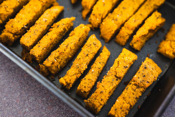  vegan dairy-free polenta chips in oven tray, plant-based food
