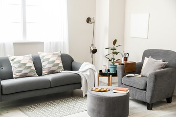 Armrest table on armchair in interior of room
