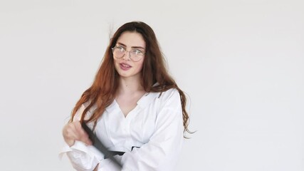 Office affair. Sensual beauty. Shy business woman flirting at work waving clipboard as hand fan to cool down smiling isolated on light copy space background. Summer romance.