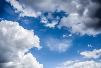 Beautiful combination of white and dark clouds in a blue sky