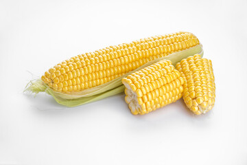 Ripe ears of corn on a white background.