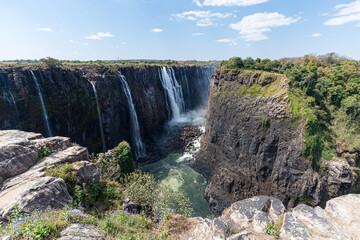 Victoria Falls is a waterfall on the Zambezi River on the border between Zambia and Zimbabwe and is...