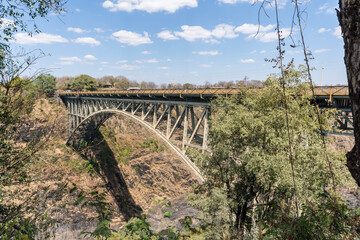 Victoria Falls, Zimbabwe: The steel bridge, built in 1904, connecting Zimbabwe and Zambia, crossing...
