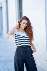 Obraz premium Young attractive red haired woman looking sexy with natural beauty. Real People Outdoors Portrait