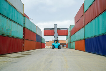 Forklift truck working lifting cargo industrial container box at shipping yard for transportation...