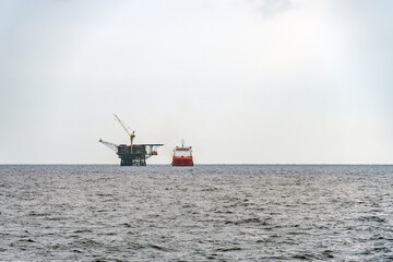 A diving support vessel alongside a platform at Terengganu oil field.
