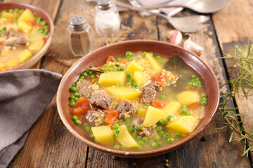 beef soup with potato, pea and carrot