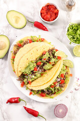 tortillas with beef, avocado, tomatoand spices