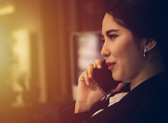  business woman in office and using mobile phone. working from home concept. 