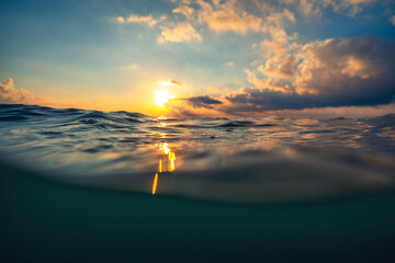 Sea wave close up, low angle view, sunrsie shot