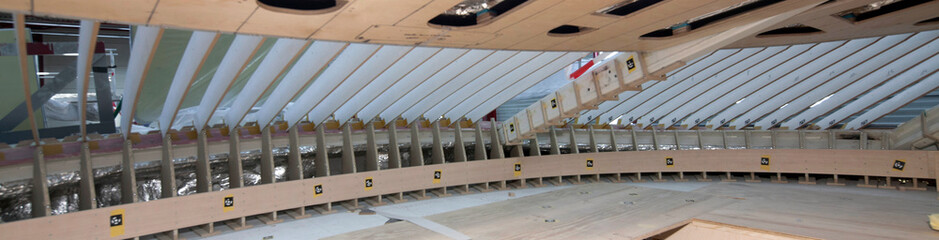Wheelhouse under constrction. Interior of a super sailing yacht.  Shipyard. Shipbuilding industry. Yacht builders. Casco. Panorama.  © A