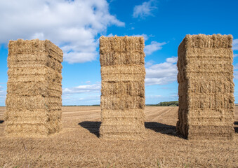 Three hay bale towers