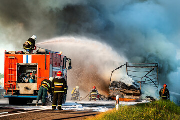 fire engine extinguishes a fire on the road