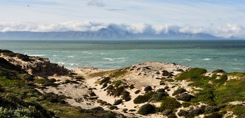 Fototapeta na wymiar Landscape with sand dunes and Mountains across the False Bay