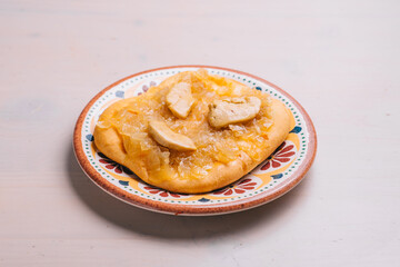 Freshly baked mini pizza сoca with chicken and onions. Traditional Spanish pastry with vegetables.