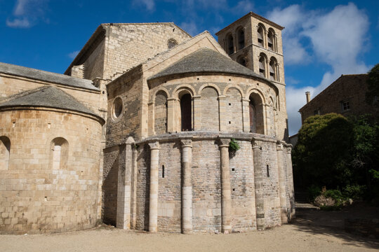The ancient stone architecture and the blooming garden of the old  catholic Caunes Minervois abbey located in the most beautiful medieval village of France