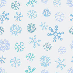 Seamless background of hand drawn snowflakes