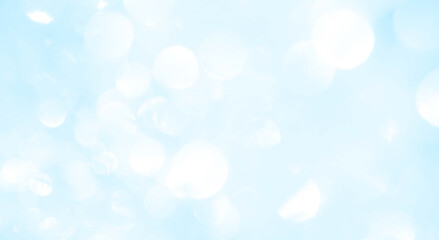 Bokeh light on blue background, sky with circle glitter light blue. Snow abstract soft glowing with vivid bright light and bokeh blur effect. 