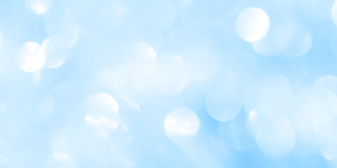 Bokeh light on blue background, sky with circle glitter light blue. Snow abstract soft glowing with vivid bright light and bokeh blur effect. 