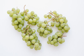 bunches of grapes on a white background, green grapes on white background