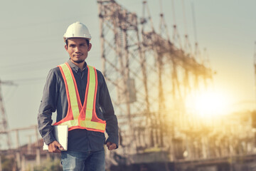 Engineer holding tablet standing factory outdoor