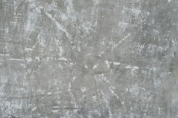 Old concrete wall with remnants of plaster for the backdrop.
