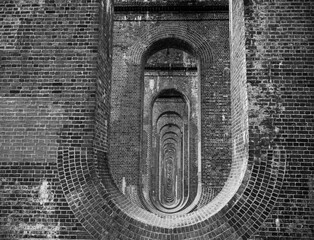 The Ouse Valley Viaduct, opened in 1841 near Balcombe, Sussex, supports the London-Brighton Railway...