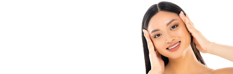 Panoramic shot of young asian woman touching face isolated on white