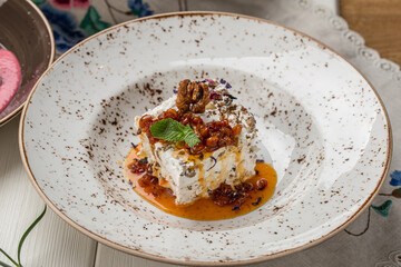 meringue cake dessert with nuts on the table at restaurant