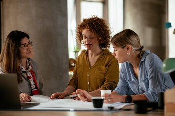 Businesswomen working on a new project. Colleagues discussing about problem they have to solved