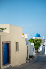 Fototapeta na wymiar Blue dome church in Megalochori village, Santorini island, Greece.