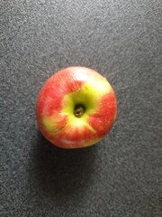 red apple on a black