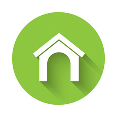 White Dog house icon isolated with long shadow. Dog kennel. Green circle button. Vector.