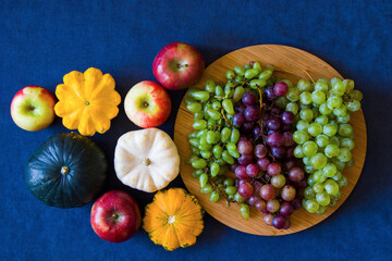 Autumn and fall harvest, pumpkin, apple, grape and pattison